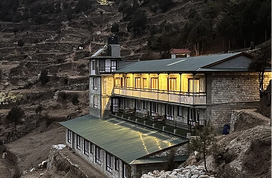 Building set against a dramatic hill