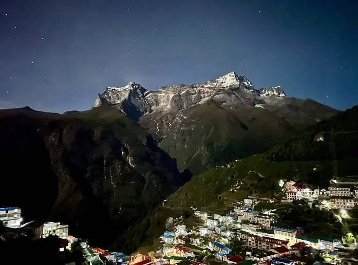 Colourful prayer flags and market stalls in Namche Bazaar